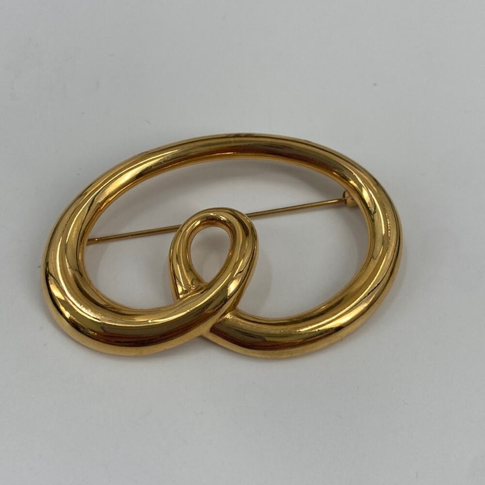 Monet goldtone Swirl brooch